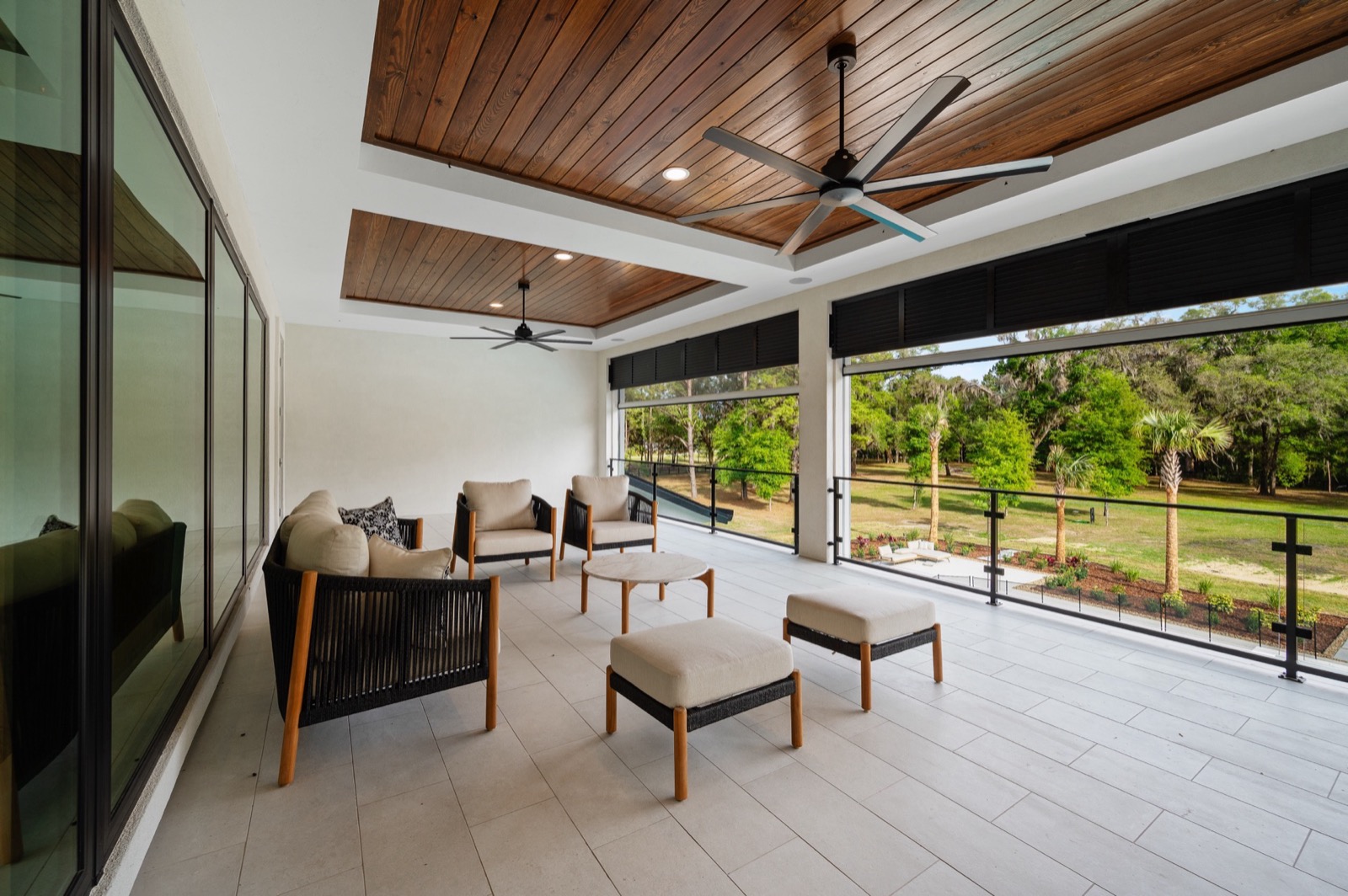 Screened porch with motorized retractable screens