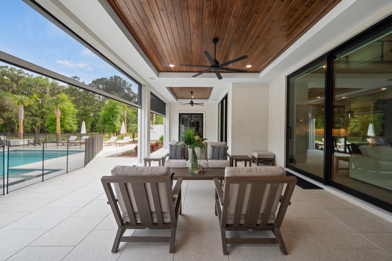 Outdoor living room behind retractable screens